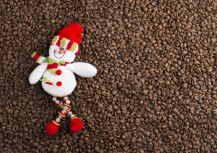 Christmas snowman on coffee beans