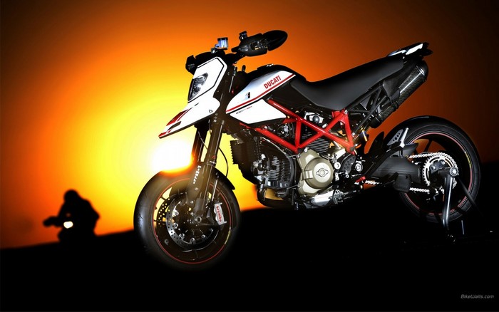 Ducati Hypermotard motorcycle against a sunset