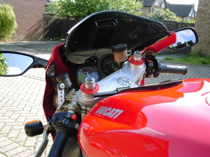 Red Ducati motorcycle handlebars and fuel tank