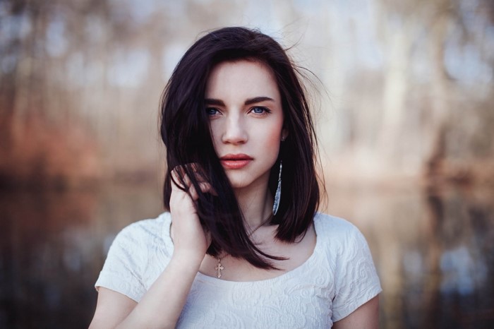 Woman with dark hair and blue eyes
