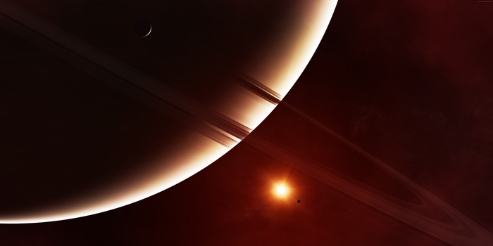 Saturn and its rings with a moon and sun