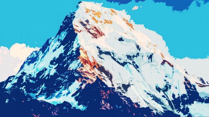 Snow-capped mountain range under a blue sky