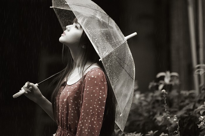 Woman holding an umbrella in the rain