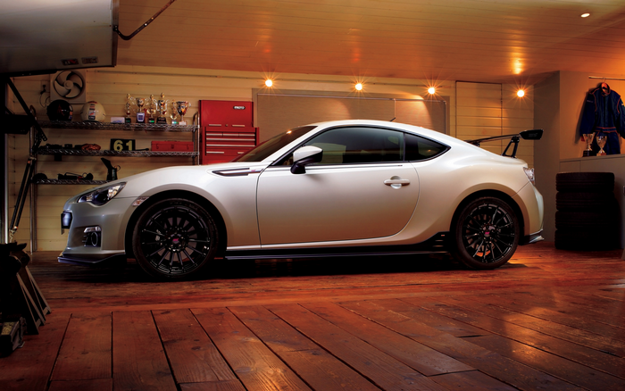White Subaru BRZ STI sports car in a garage