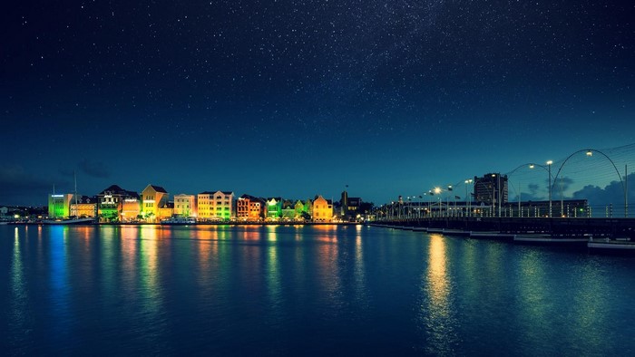Willemstad cityscape at night with stars and reflections