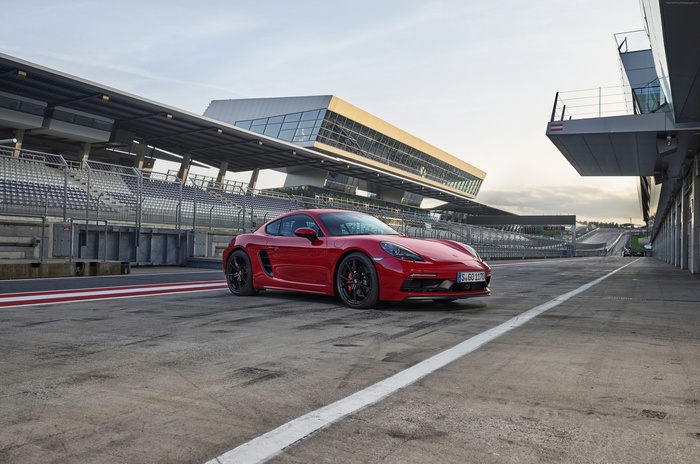 Red Porsche 718 Cayman GTS on a Race Track