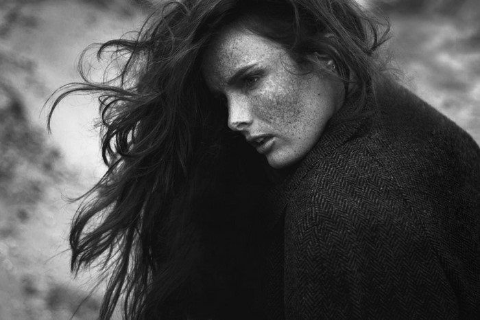 Monochrome portrait of a woman with freckles