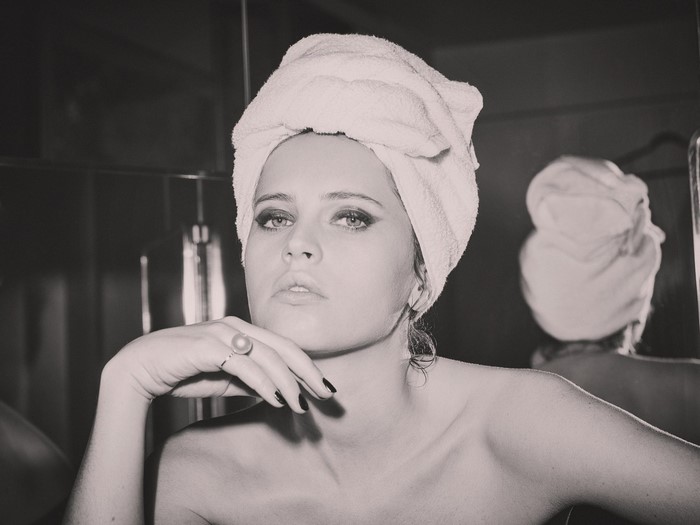 Felicity Jones with a towel on her head