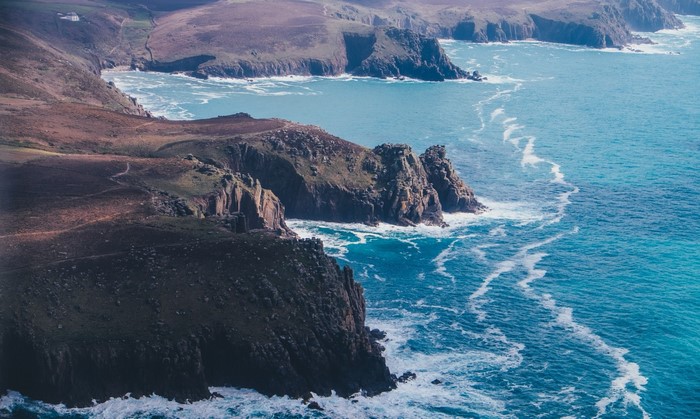 Rugged coastline with turquoise sea and waves