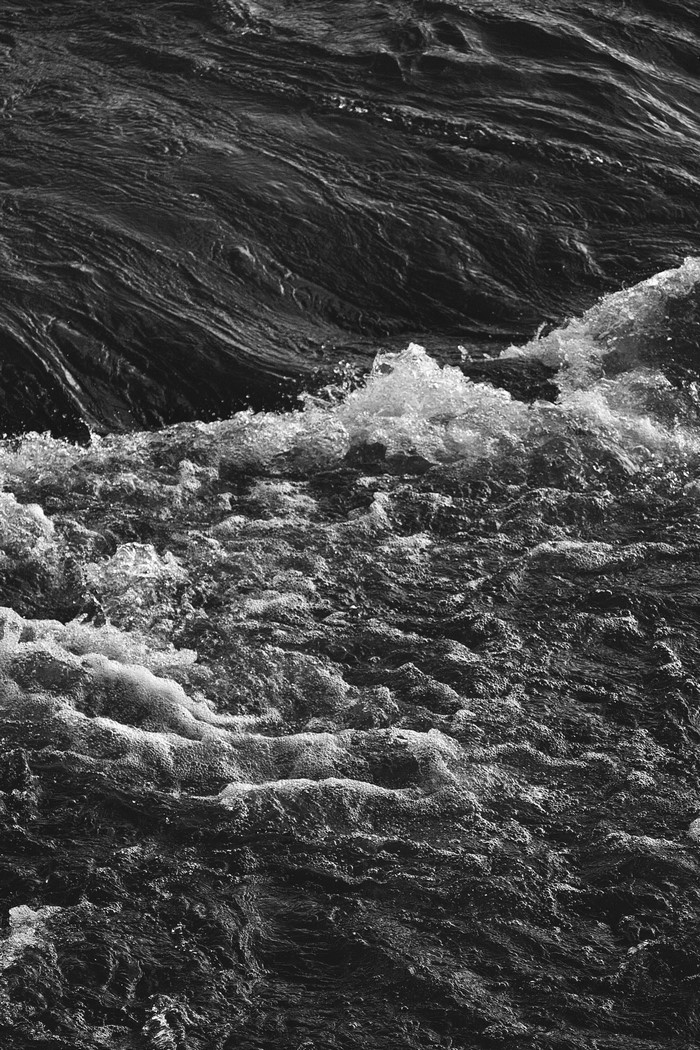 Monochrome photography of turbulent water waves
