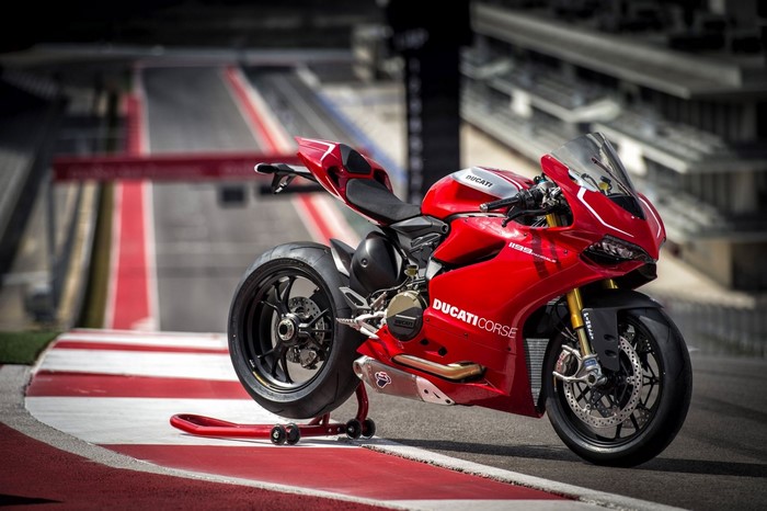 Red Ducati Corse Superbike Motorcycle on Race Track