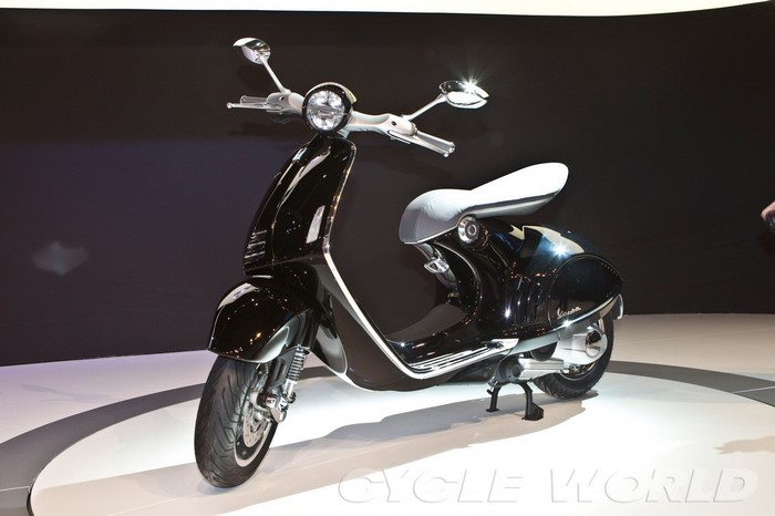 Black Vespa scooter on display