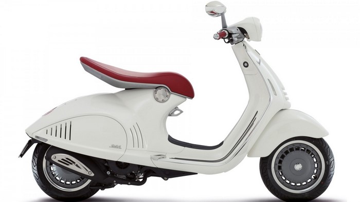 White Vespa scooter with red seat
