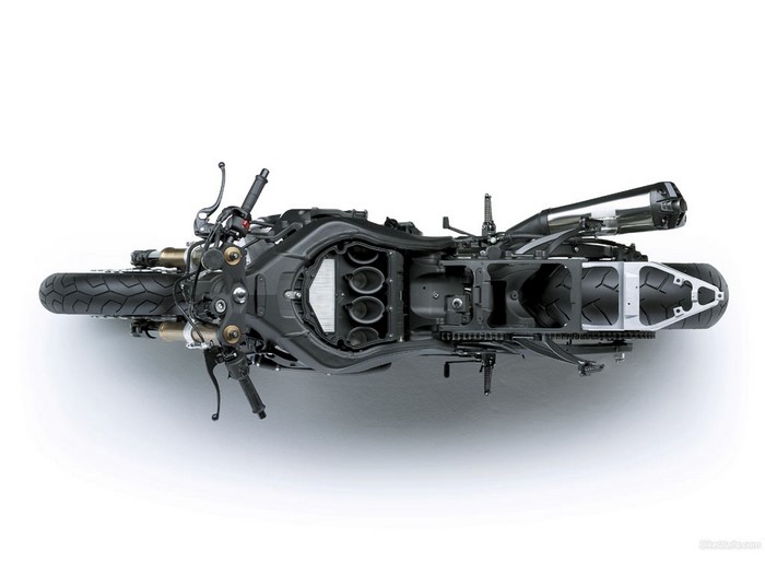 Top view of a disassembled Kawasaki motorcycle engine and chassis
