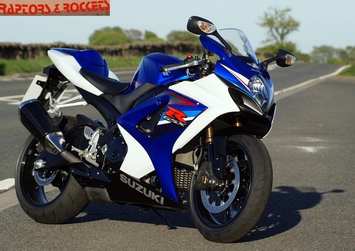 Blue and white Suzuki GSX-R motorcycle on a road