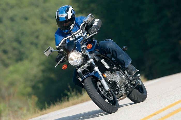 Suzuki motorcycle rider on a winding road