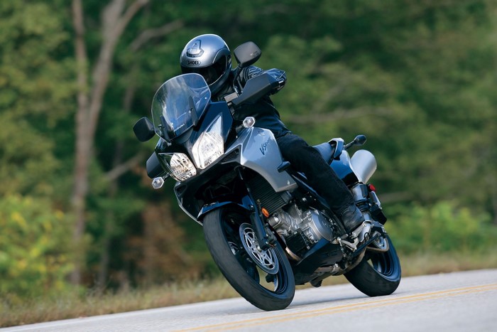 Suzuki V-Strom motorcycle with rider on a road