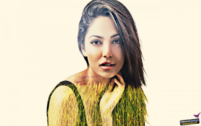 Double exposure portrait of a woman with wheat field
