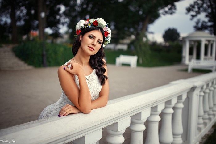 Woman with flower crown in white dress
