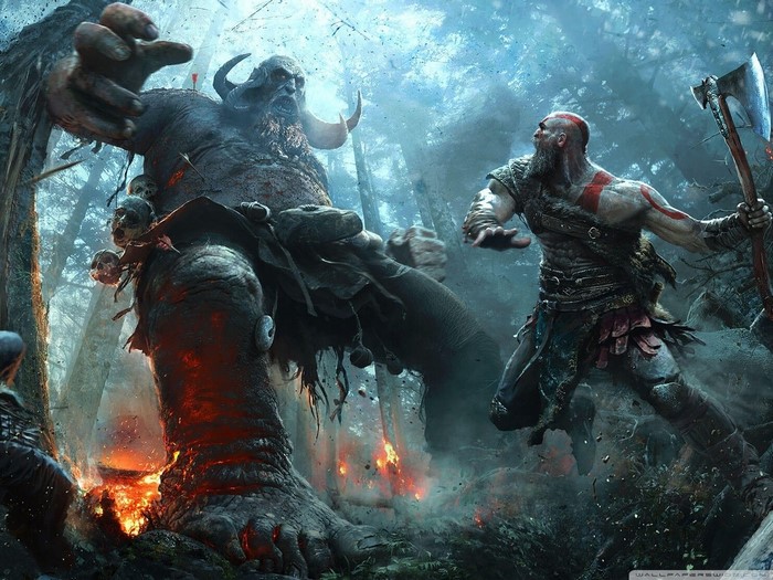 Kratos fighting a giant in a forest from God of War