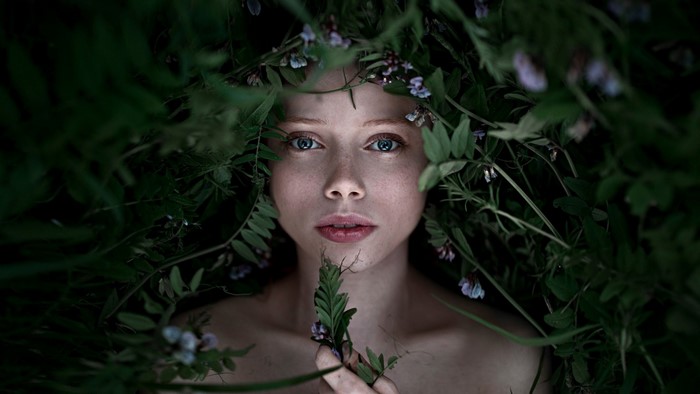 Portrait of a woman with flowers and leaves