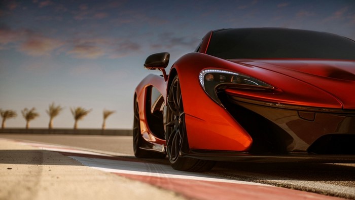 Red McLaren P1 sports car on a race track