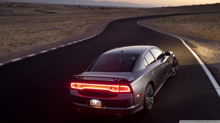 Gray Dodge Charger on a Racetrack at Dusk