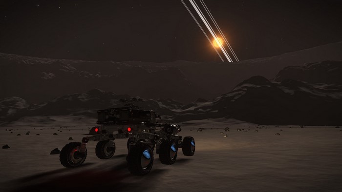 Rover on a moon with rings and a star