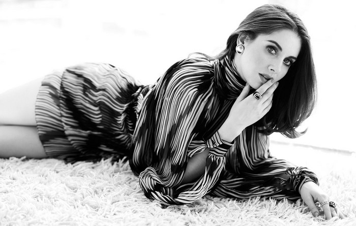 Alison Brie posing on a rug