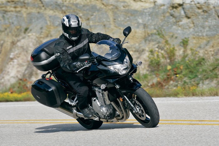 Suzuki Bandit 1250 motorcycle with saddlebags on a road