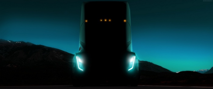 Tesla Semi Truck at night with mountains
