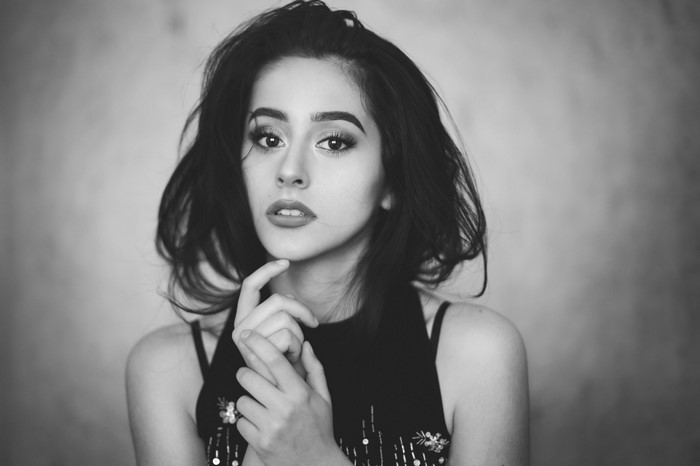 Monochrome portrait of a young woman with dark hair