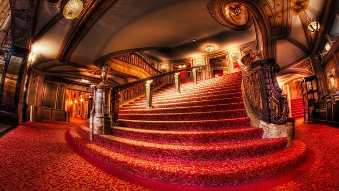 Grand staircase in a luxurious theatre lobby