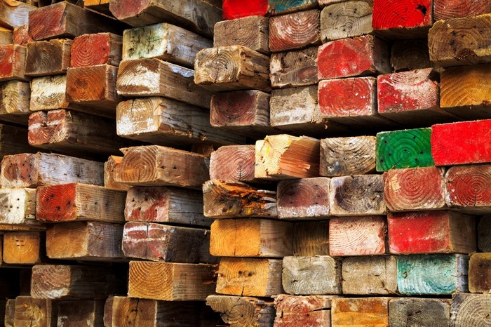Stack of colorful painted lumber and wood texture