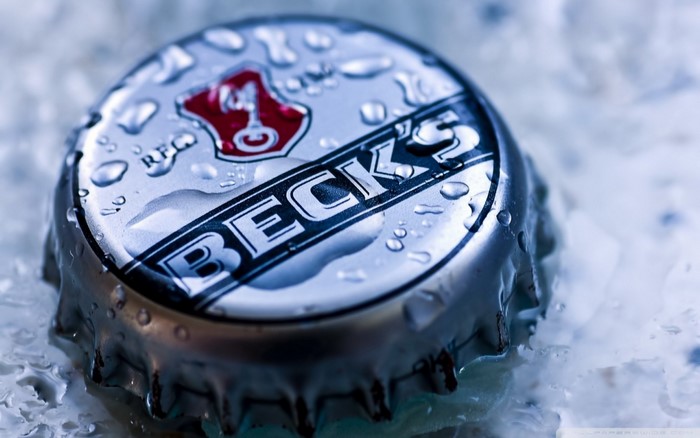 Close-up of a wet Beck's beer bottle cap