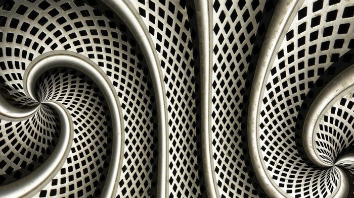 Abstract metallic spiral pattern with diamond grid