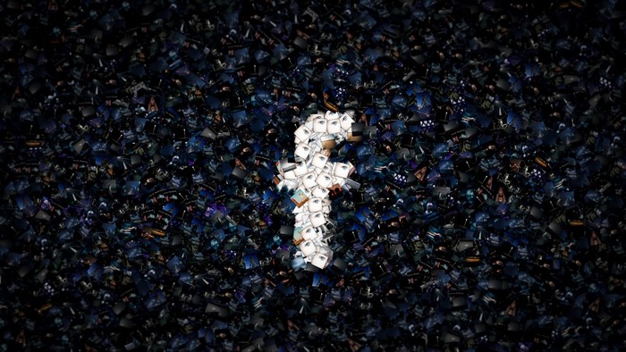 Facebook logo made of small images on a dark background