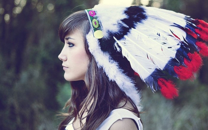 Woman wearing a colorful feather headdress