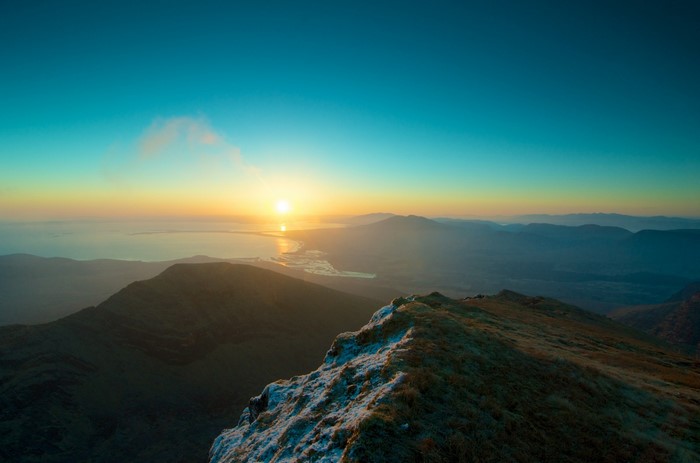 Sunrise over mountains and sea