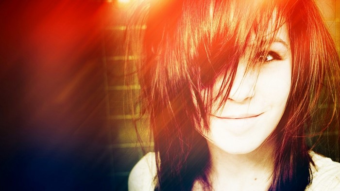 Young woman with messy hair smiling