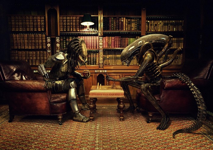Predator and Alien playing chess in a library