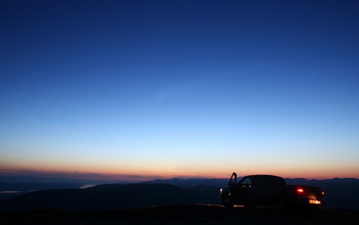 Pickup truck parked on a hill at dusk