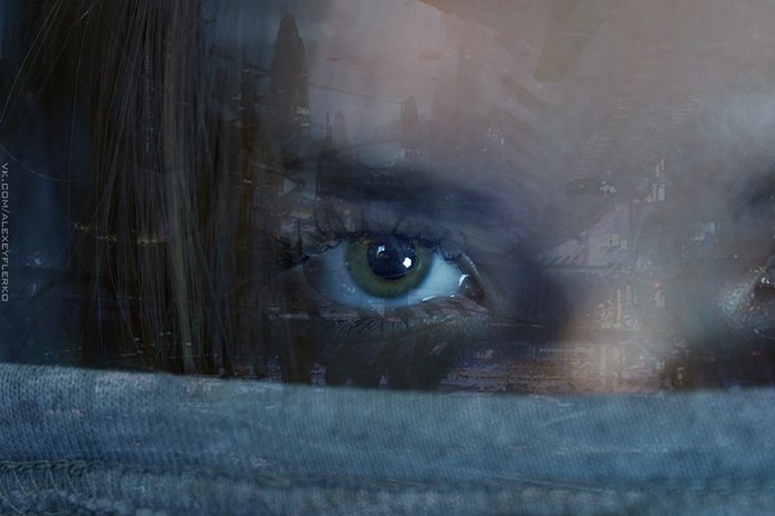 Close up of a woman's eye with city overlay