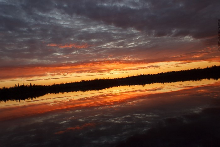 Sunset over a lake with reflection
