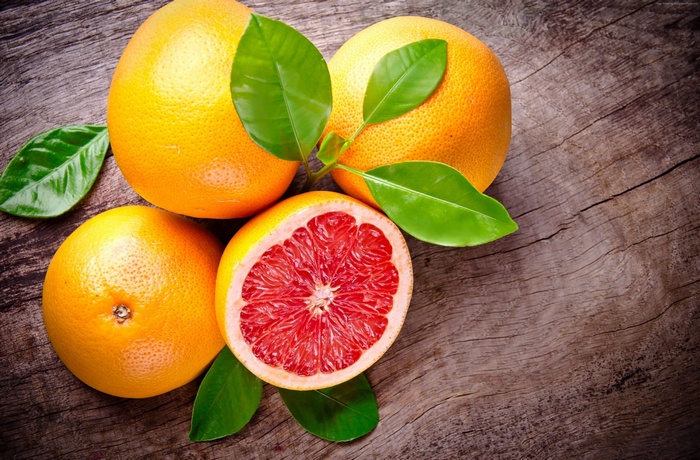 Grapefruits on a wooden surface