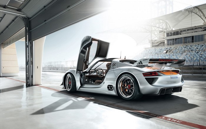 Porsche 918 RSR sports car with doors open at a racetrack