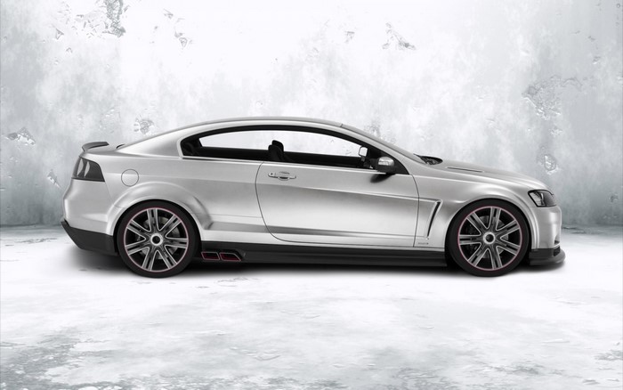 Silver sports coupe with custom rims