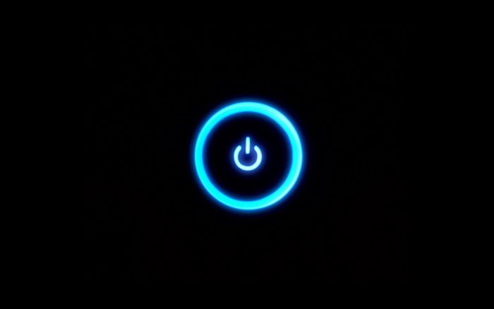 Blue neon power button symbol on black background