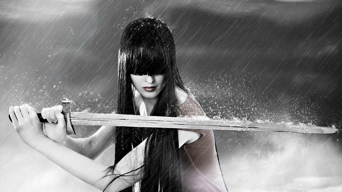 Woman with sword in the rain