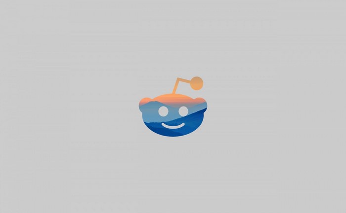 Reddit logo with mountain and sunset landscape